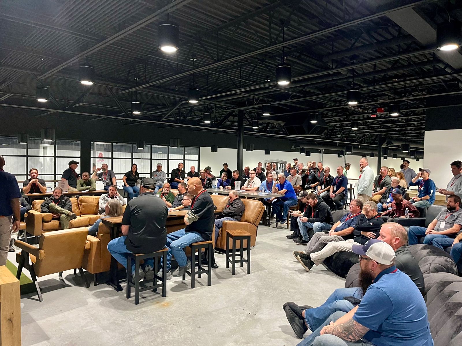 Wide view of the crowd in the upstairs event space